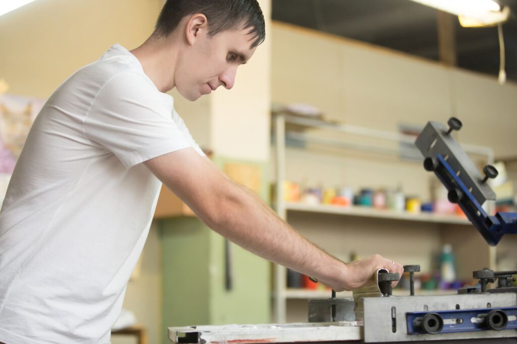 man screen printing